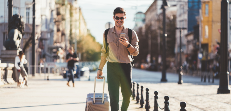 man traveling using smartphone