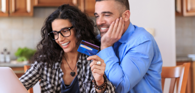 couple using credit card for online purchase