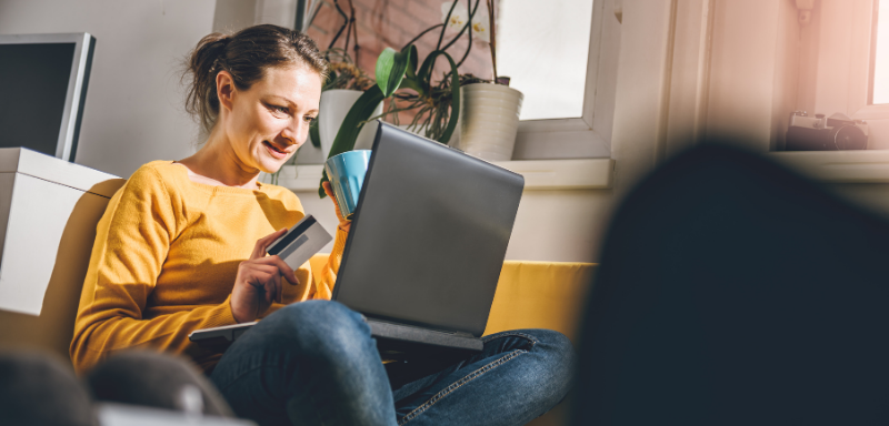 woman using credit card for online purchase